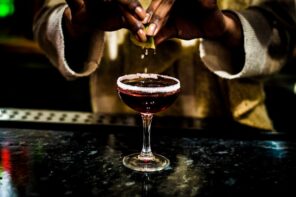 bartender pours cocktails