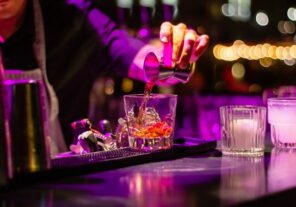 bartender pours cocktails